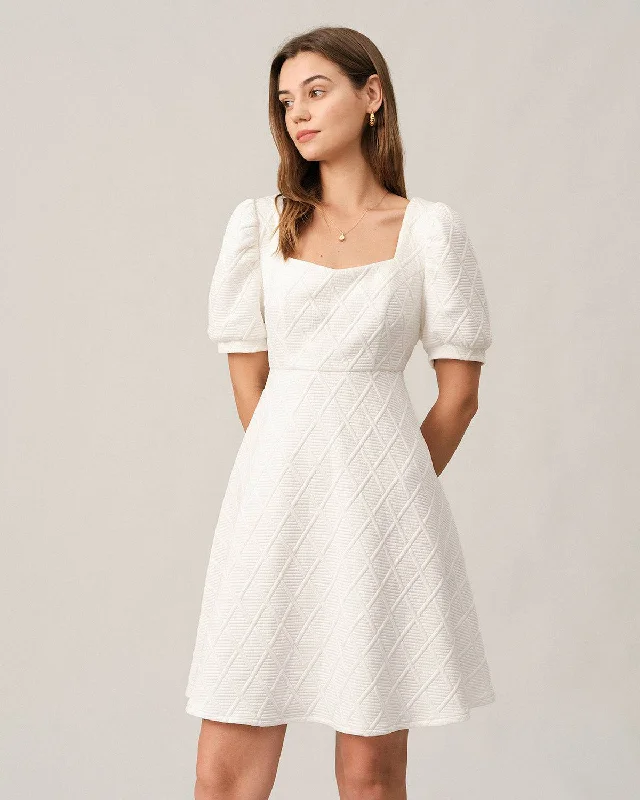 Mini dresses with pom - pom trims for a playful feel The Solid Textured Puff Sleeve Mini Dress Mini dresses with pom - pom trims for a playful feel The Solid Textured Puff Sleeve Mini Dress