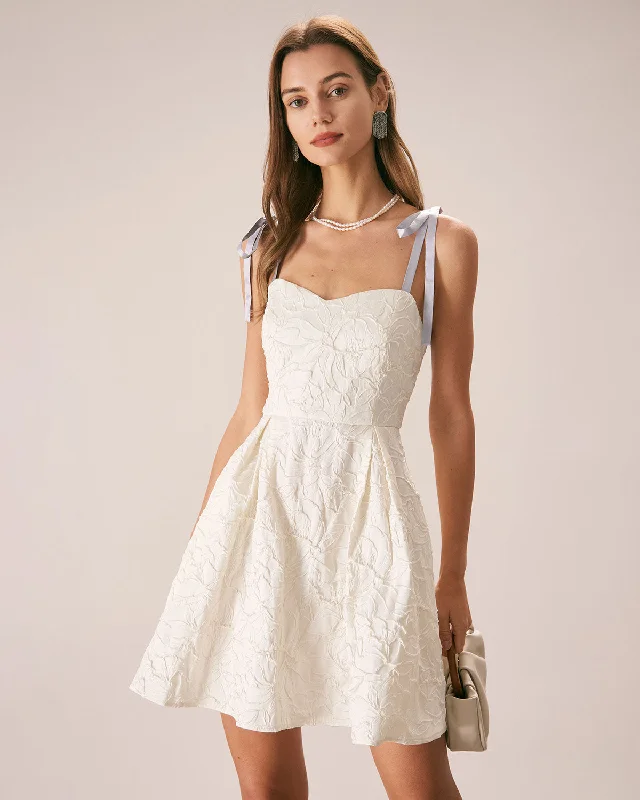 Mini dresses with pocket details for added functionality The Off White Jacquard Tie Strap Mini Dress Mini dresses with pocket details for added functionality The Off White Jacquard Tie Strap Mini Dress
