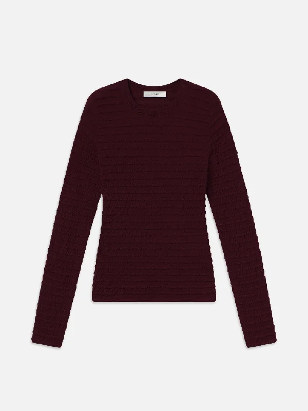Distressed Denim Top for a Trendy and Edgy LookSmocked Long Sleeve Crewneck -- Wine